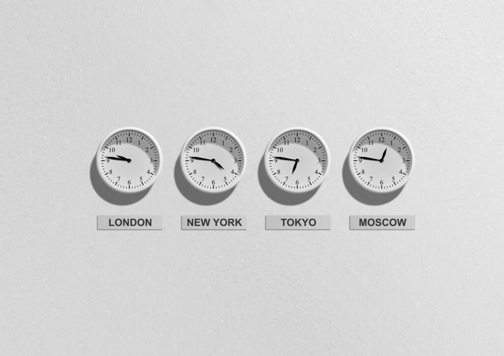 Row of wall clocks showing the time in London, New York, Tokyo and Moscow