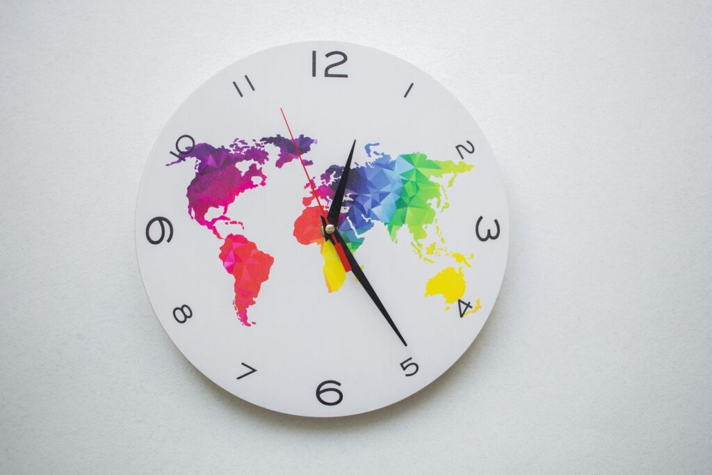 Wall clock with a colorful world map on its face